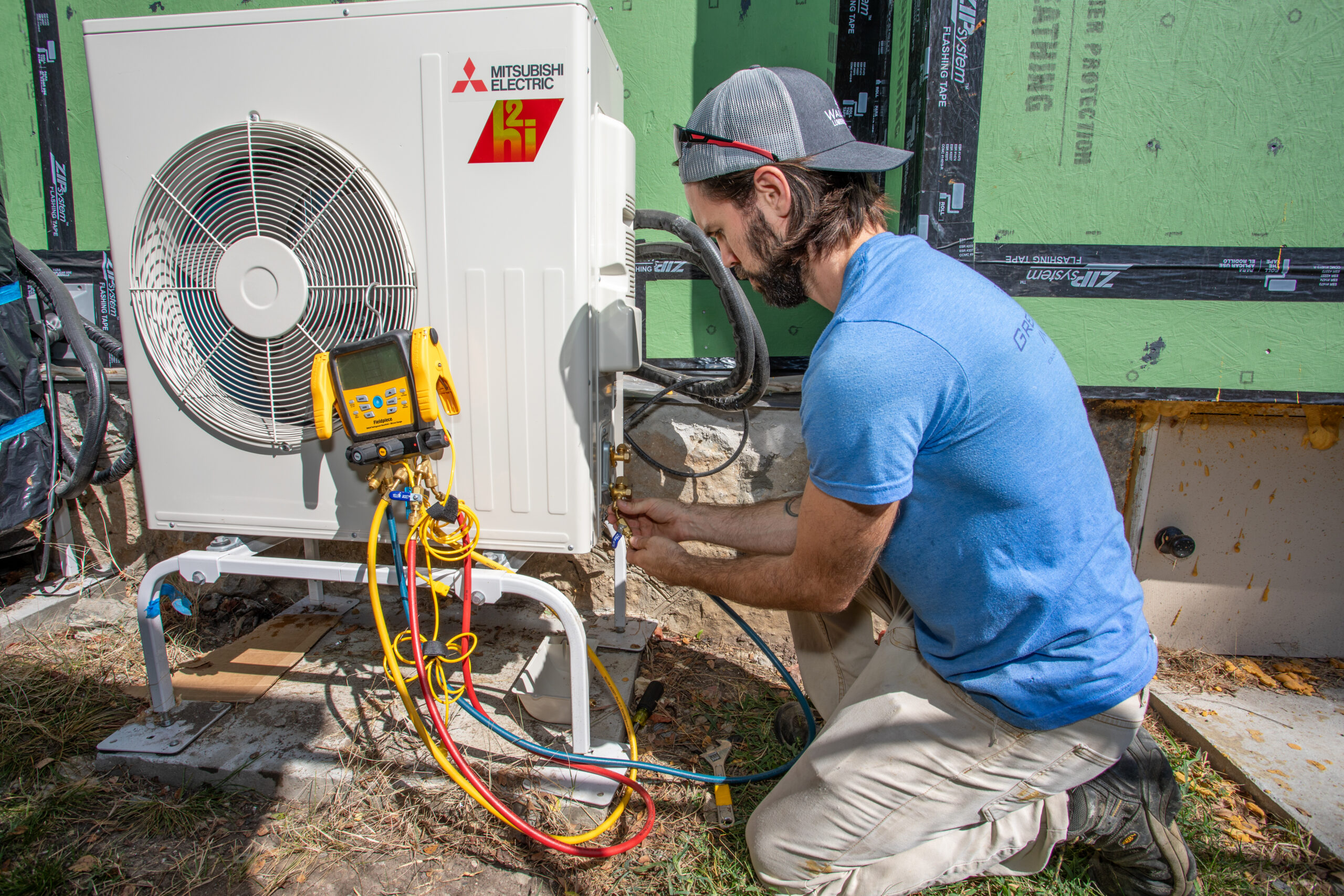HVAC2 e3 innovate worker installing a heat pump