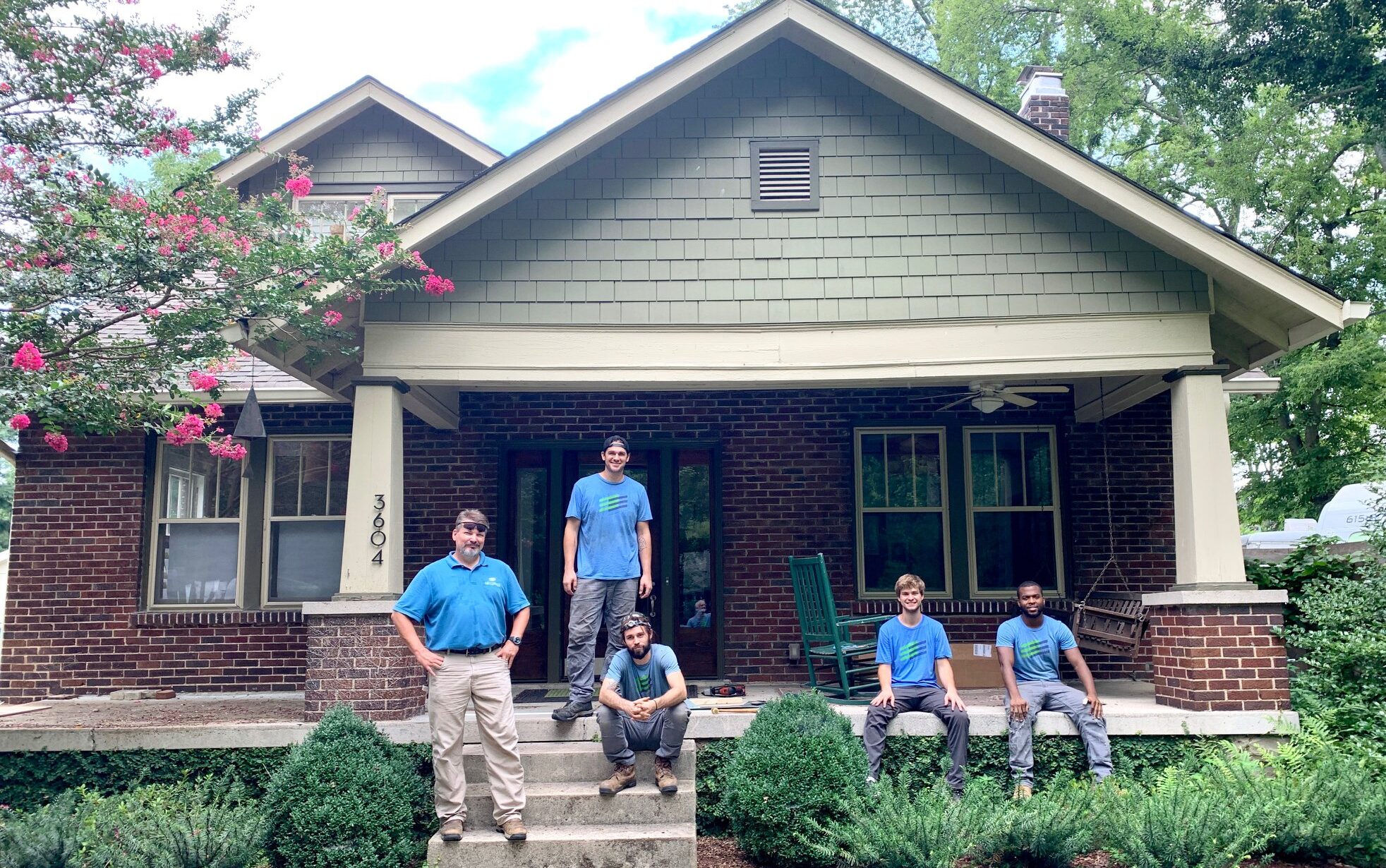 E3 Innovate crew on the porch of a home