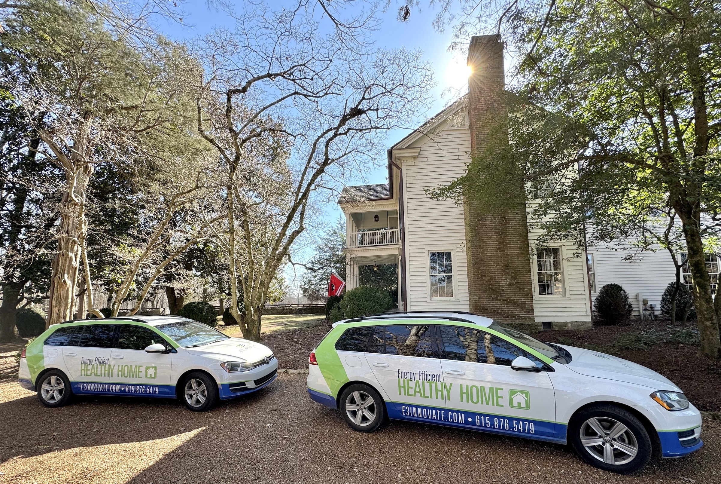 E3 Innovate Cars In Front Of House